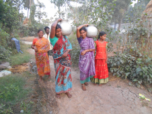 Women taking water with Joy.jpg